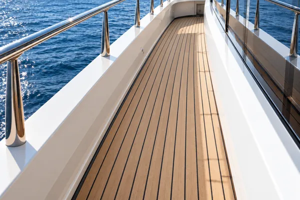 The same teak deck after rinsing and drying